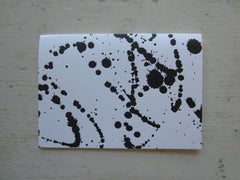 splatter paint black folded notes
