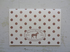 polka dot brown folded note on ecru
